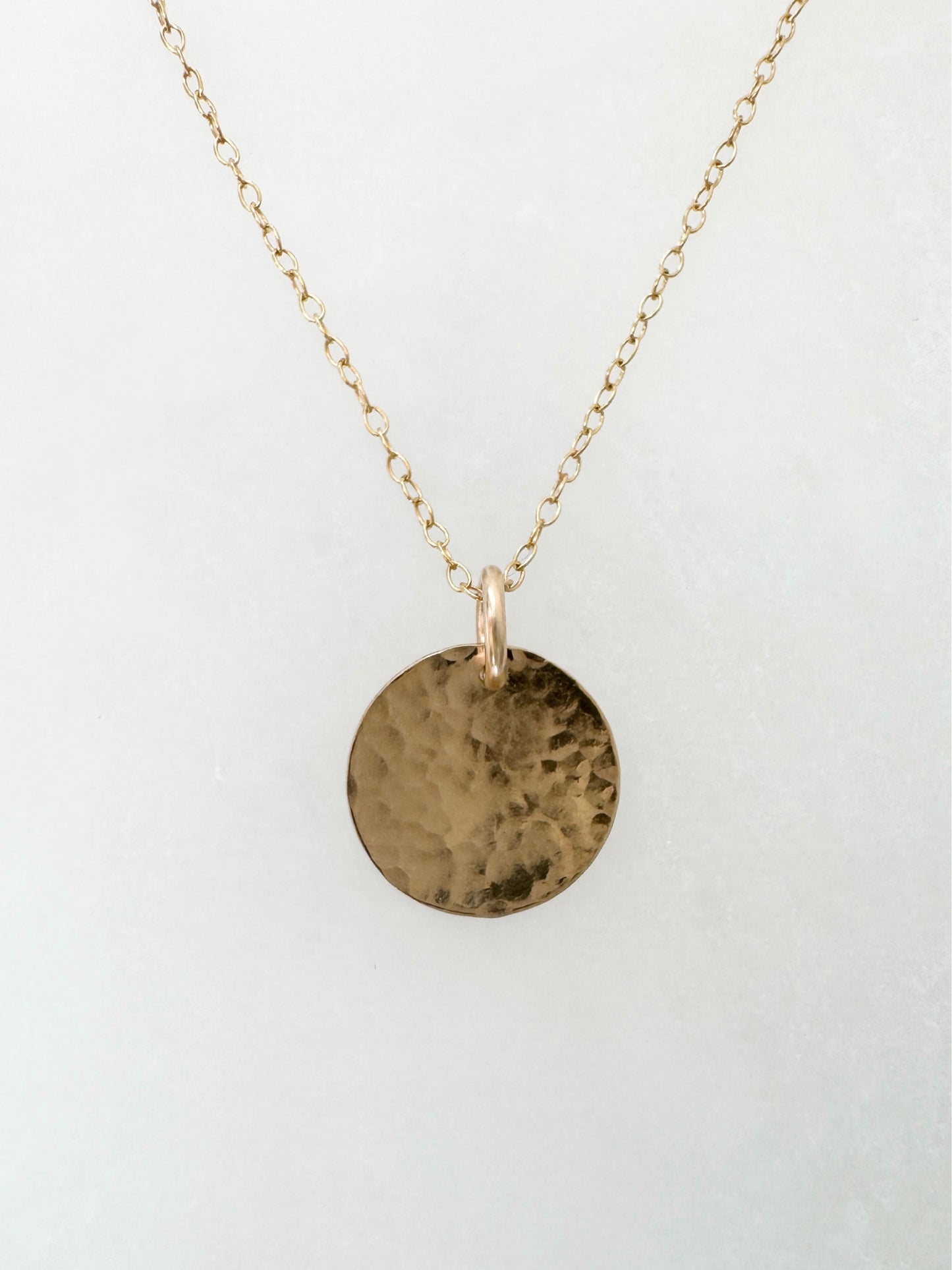 Gold disc pendant